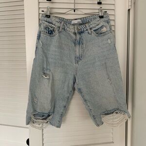 Long distressed denim cutoff shorts